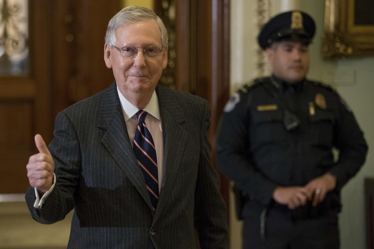 Senate Majority Leader Mitch McConnell of Ky. gives members of the media a thumbs up as he leaves the Senate chamber on Capitol Hill in Washington, Tuesday, Feb. 7, 2017, after the Senate confirmed Betsy DeVos as education secretary, with Vice President Mike Pence breaking a 50–50 tie. (AP Photo/Andrew Harnik)