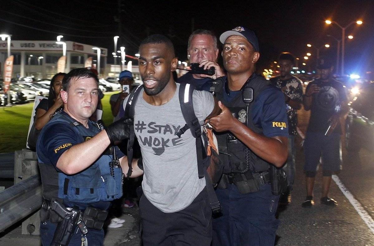 On July 9, 2016, DeRay Mckesson is arrested in Baton Rouge, Louisiana following the shooting of Alton Sterling (Max Becherer/AP).