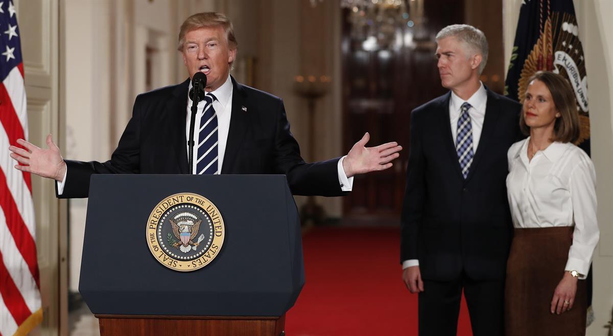President Donald Trump speaks in the East Room of the White House in Washington, Tuesday, Jan. 31, 2017, to announce Judge Neil Gorsuch as his nominee for the Supreme Court. Gorsuch stands with his wife Louise. (AP Photo/Carolyn Kaster)