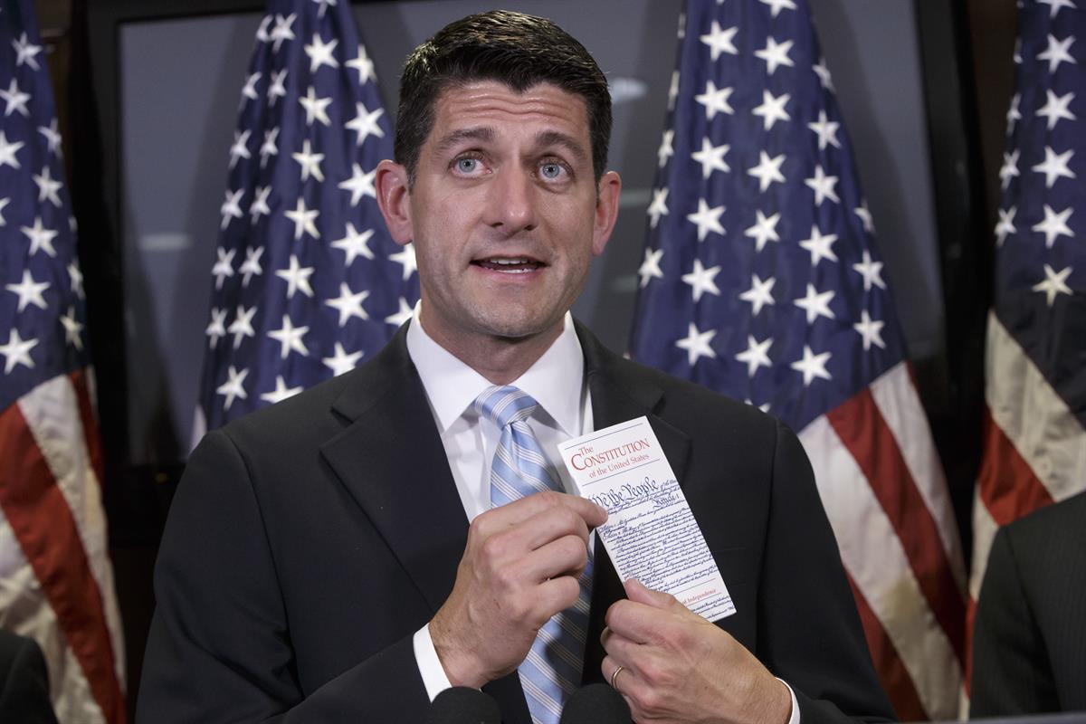 House Speaker Paul Ryan of Wis. points to his copy of the Constitution as he emphasizes to reporters that the GOP’s proposed gun control measures protect Second Amendment rights, July 6, 2016(AP Photo/J. Scott Applewhite)