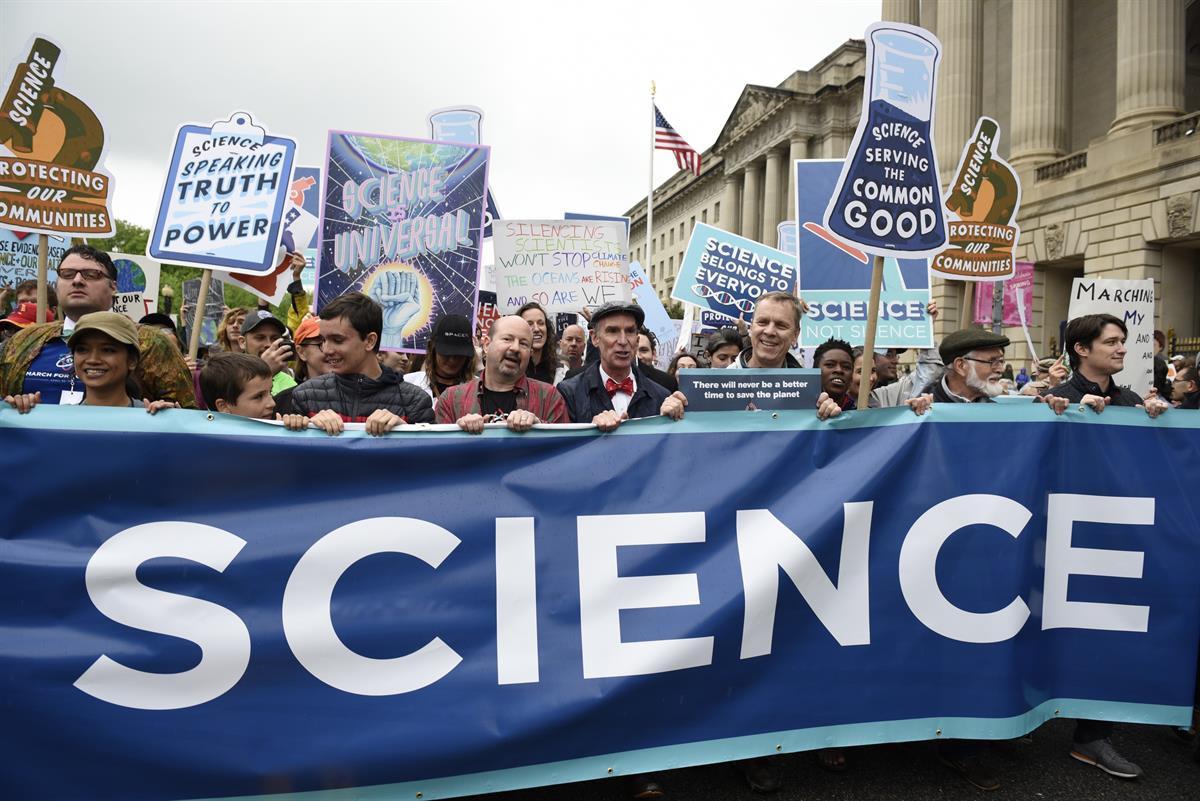 Protestors (including Bill Nye) carry a banner and signs as they pass the U.S. Environmental Protection Agency during the March For Science in Washington — Saturday, April 22, 2017 (AP Photo/Sait Serkan Gurbuz)