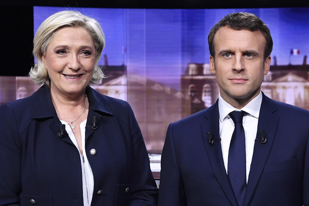 French presidential election candidate for the far-right Front National party, Marine Le Pen, left, and French presidential election candidate for the En Marche ! movement, Emmanuel Macron (Eric Feferberg/Pool Photo via AP)