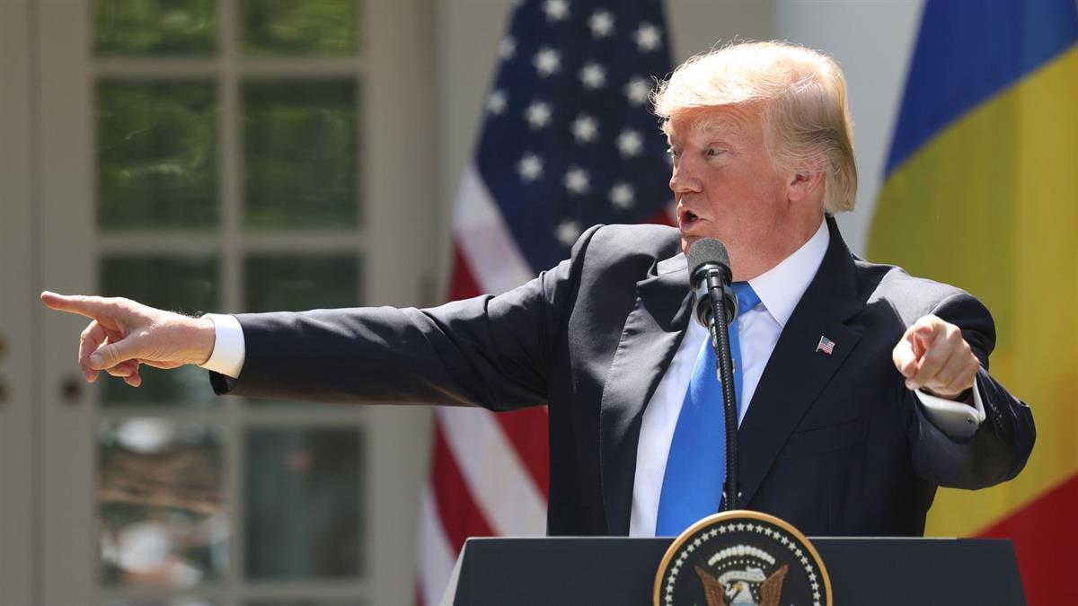 President Donald Trump, accompanied by Romanian President Klaus Werner Iohannis, speaks during a news conference in the Rose Garden at the White House, Friday, June 9, 2017, in Washington. (AP Photo/Andrew Harnik)