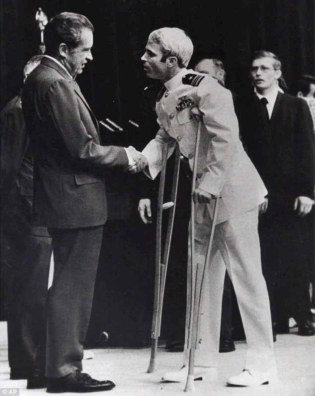 Photo Credit: AP Photo, John McCain shakes President Richard Nixon’s hand after his release in 1973, following five years as a prisoner in Vietnam.