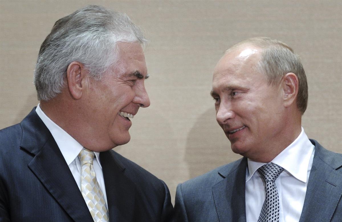 Rex Tillerson and Vladimir Putin during a signing ceremony in the Black Sea resort of Sochi, Russia, Aug. 30, 2011. (AP photo/RIA Novosti, Alexei Druzhinin, pool)