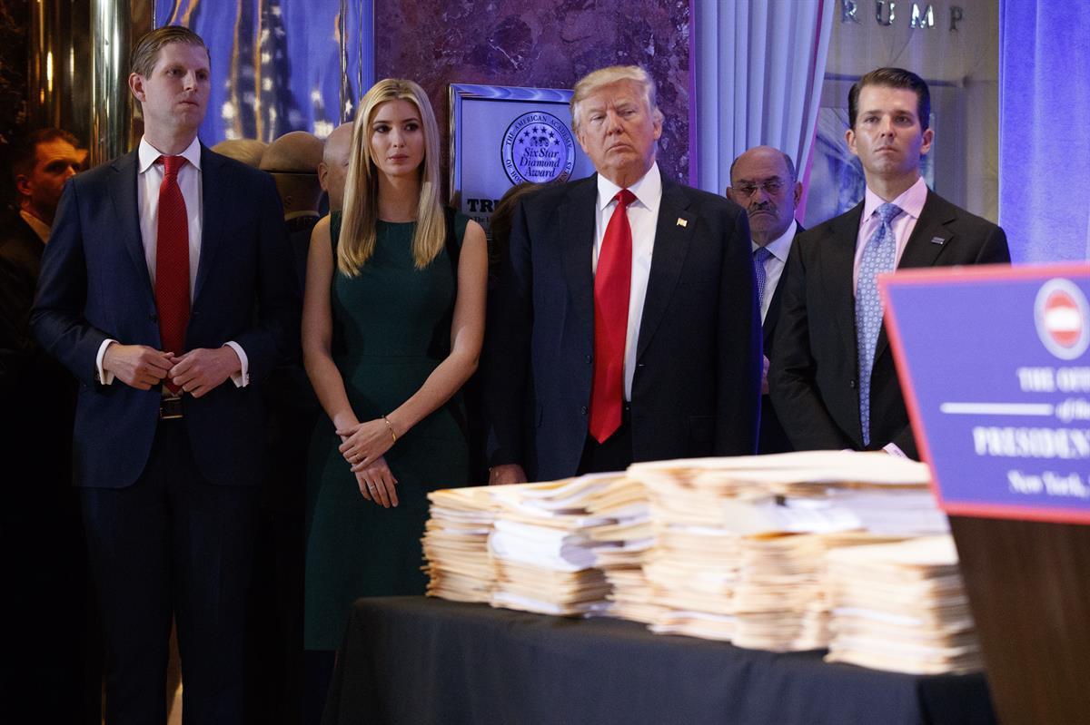 President-elect Donald Trump, accompanied by his family, at news conference in the lobby of Trump Tower in New York Wednesday Jan. 11, 2017. (AP Photo/Evan Vucci)