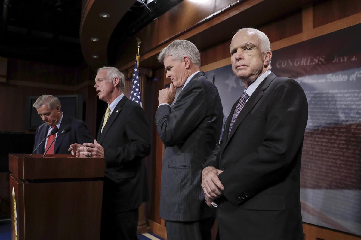 From left, Sen. Lindsey Graham (R-SC)., Sen. Ron Johnson (R-WI), Sen. Bill Cassidy (R-LA)., and Sen. John McCain (R-AZ) speak to reporters at the Capitol — Thursday, July 27, 2017. (AP/J. Scott Applewhite)