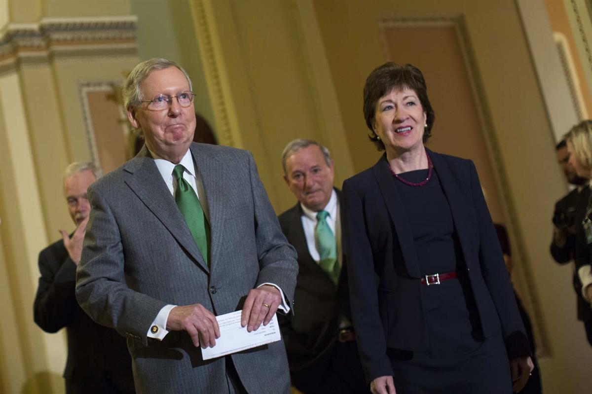 Senate Majority Leader Mitch McConnell stands with Senator Susan Collins, who is one of four Senate Republicans who remains to be against the new health care. (Credit: Drew Angerer/Bloomberg via Getty Images)
