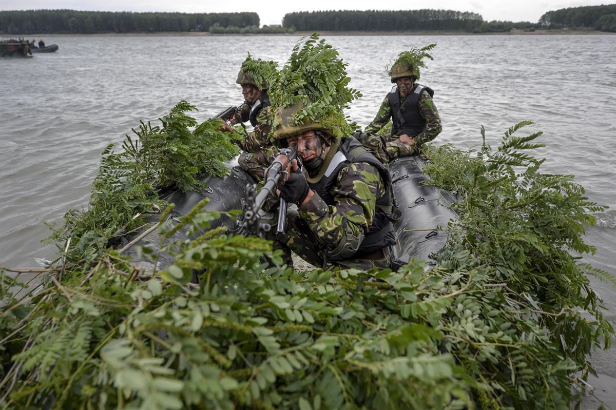 Romanian soldiers take part in a joint exercise with US troops during Argedava Saber 17, a stage in Saber Guardian 17 exercises, in Bordusani, Ialomita, Romania — Sunday, July 16, 2017. (AP/Andreea Alexandru)