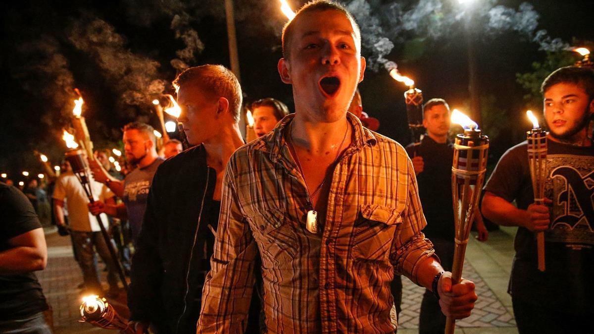 White supremacists march with torches through the UVA campus in Charlottesville, VA- Friday, Aug. 11, 2017 (Mykal McEldowney/The Indianapolis Star via AP)
