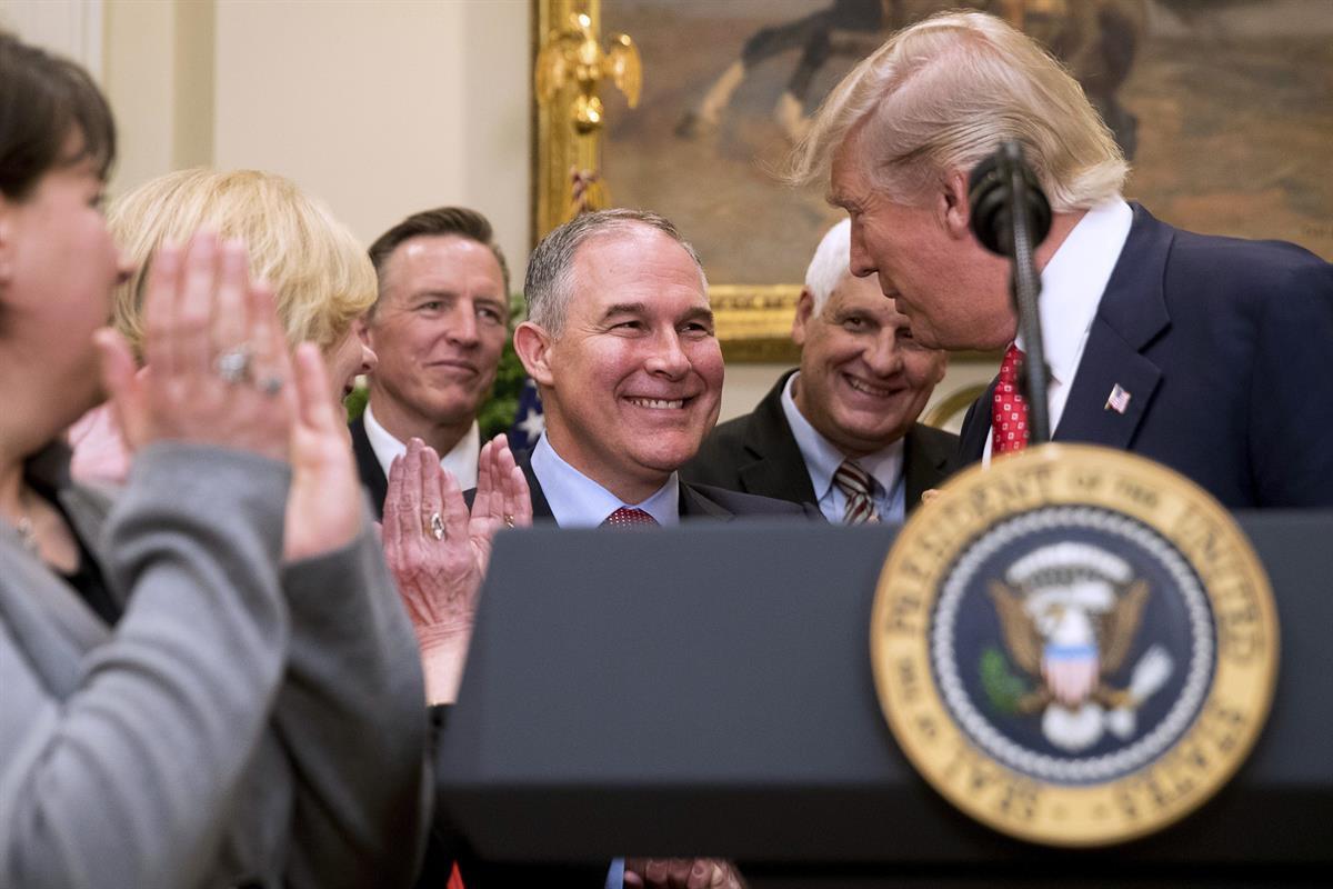 President Donald Trump shakes hands with Environmental Protection Agency (EPA) Administrator Scott Pruitt, before signing the Waters of the United States (WOTUS) executive order, Tuesday, Feb. 28, 2017, in the Roosevelt Room (AP Photo/Andrew Harnik)
