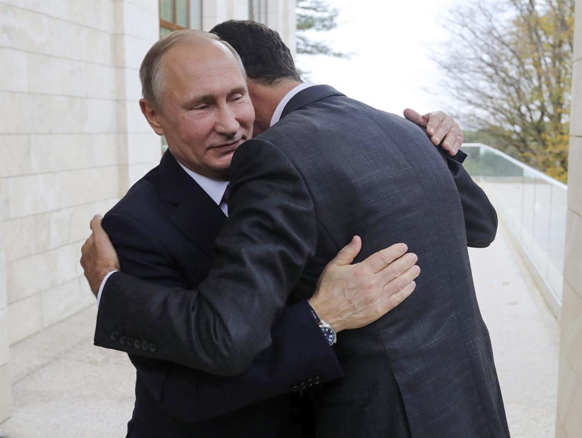 Russian President Vladimir Putin, left, embraces Syrian President Bashar Assad in the Bocharov Ruchei residence in the Black Sea resort of Sochi, Russia?—?Nov. 20, 2017 (Mikhail Klimentyev, Kremlin Pool Photo via AP)