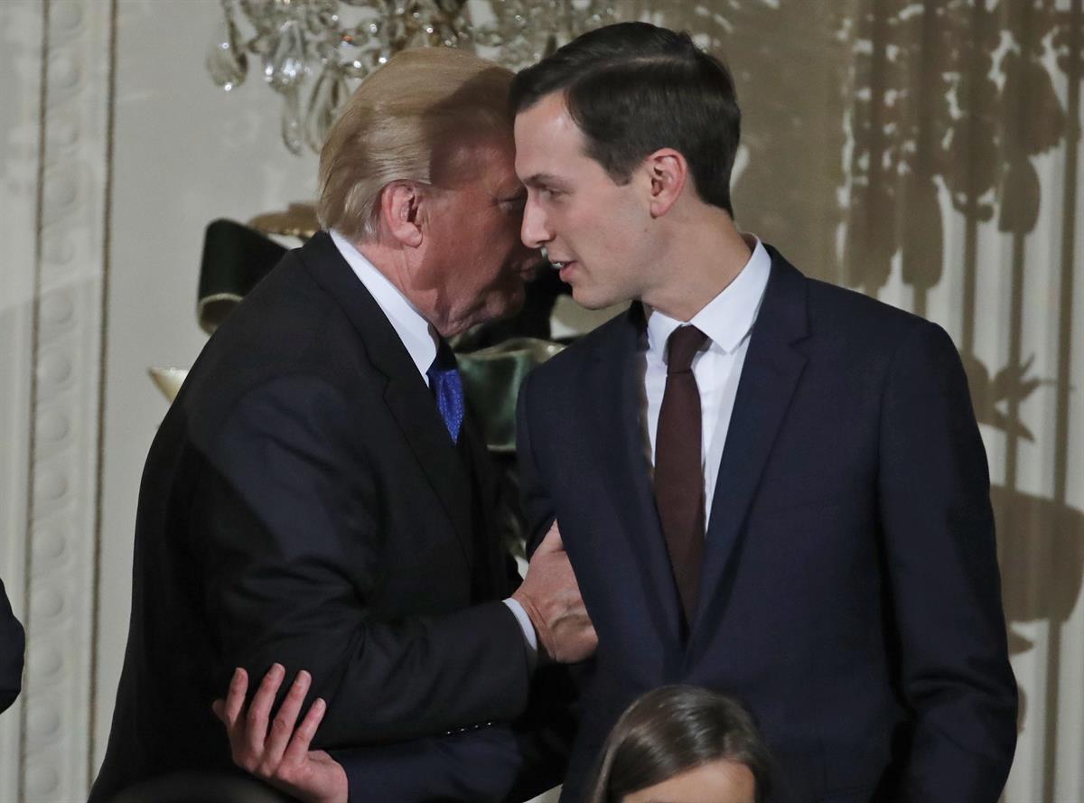 President Donald Trump speaks with White House Senior Adviser Jared Kushner as he departs after a Hanukkah reception in the East Room of the White House, Thursday, Dec. 7, 2017, in Washington. (AP Photo/Alex Brandon)