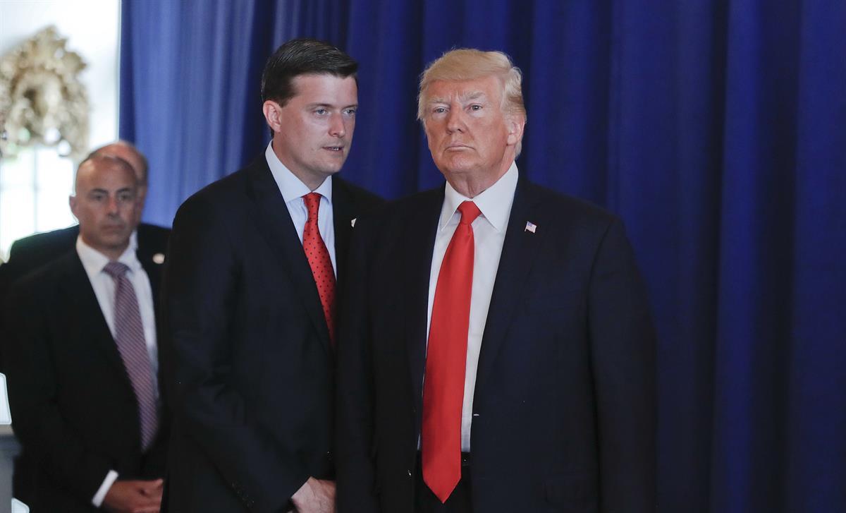Rob Porter, left, former White House Staff Secretary speaks to President Donald Trump after Trump made remarks about white supremacists in Charlottesville, Va., Saturday, Aug. 12, 2017 — (AP Photo/Pablo Martinez Monsivais)
