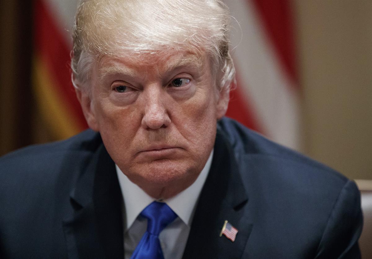 President Donald Trump pauses during a meeting in the Cabinet Room of the White House, in Washington, with members of Congress — Feb. 28, 2018 photo, (AP Photo/Carolyn Kaster)
