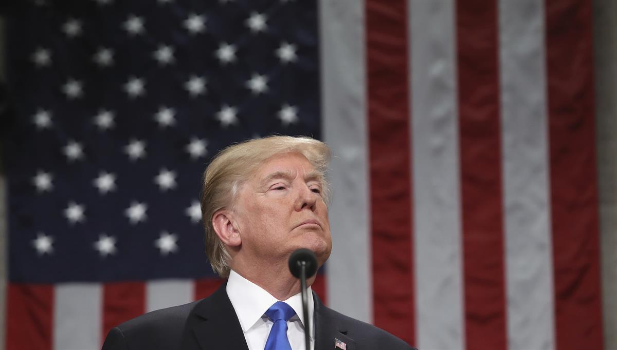 President Donald Trump pauses during the State of the Union address in the House chamber of the U.S. Capitol to a joint session of Congress Tuesday, Jan. 30, 2018 in Washington. (Win McNamee/Pool via AP)